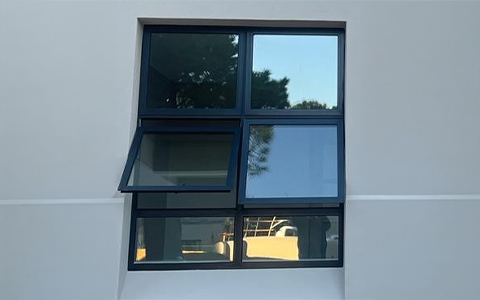 Dark-framed glass panels with one outward-opening section.